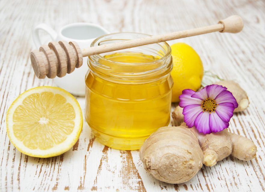 honey, lemon and ginger on a wooden background